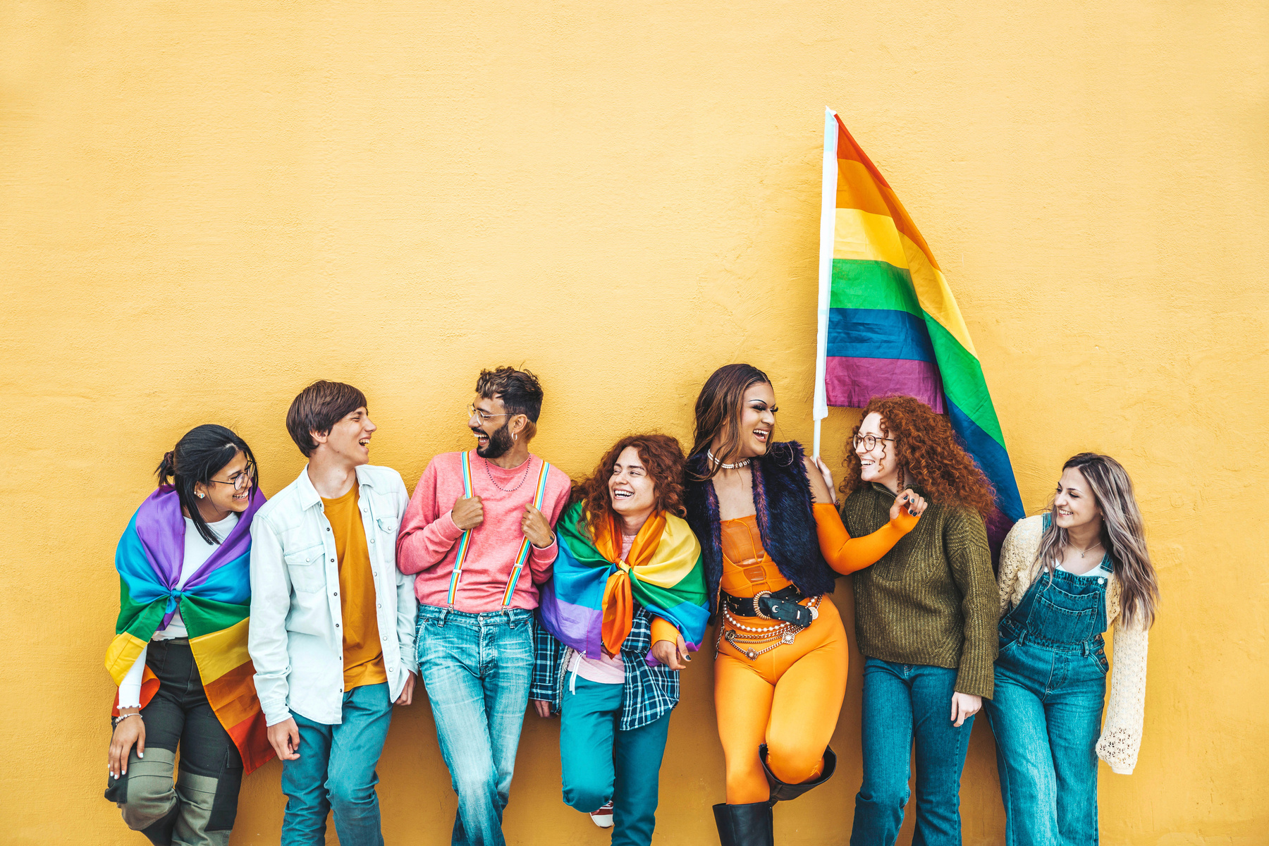 Diverse Group of People with LGBT Flags Celebrating Pride